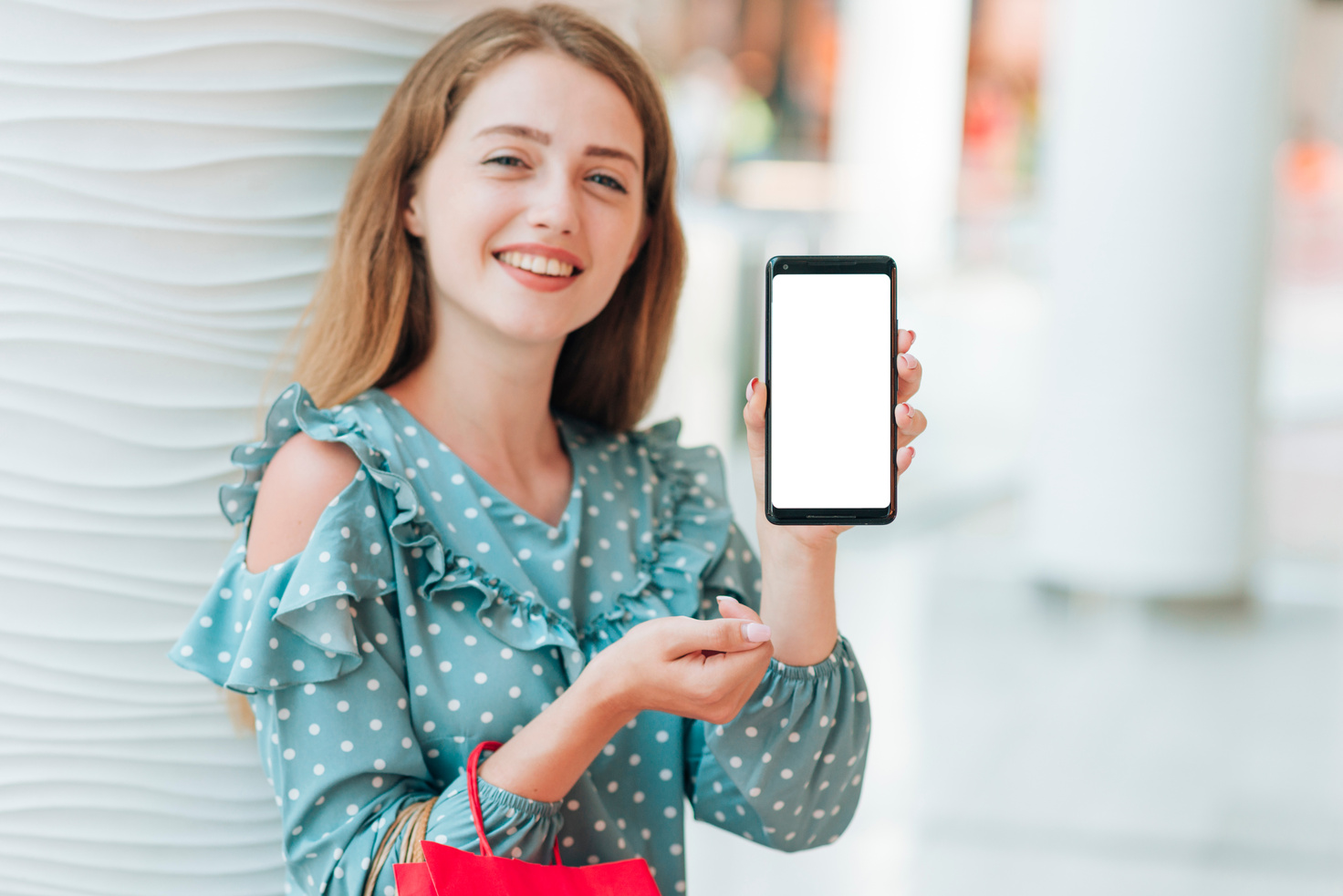 happy girl showing her phone