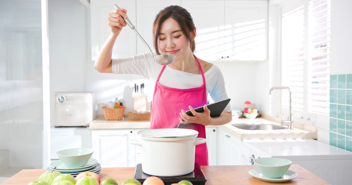 Housewife Use Tablet to Cook