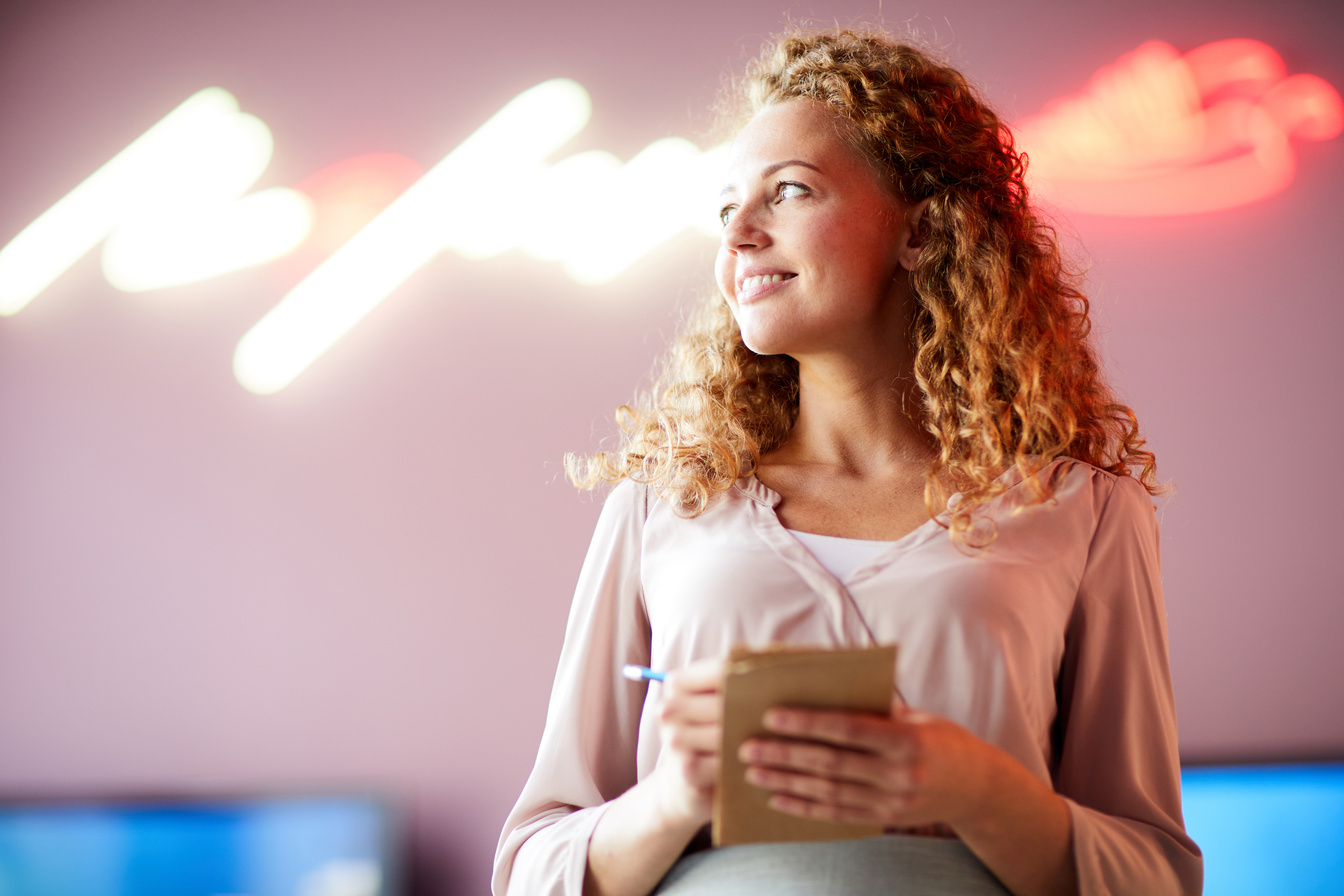 Smiling purposeful girl working in cafe