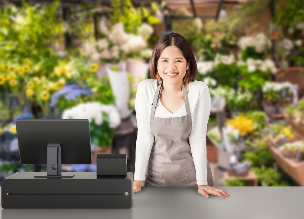 Asian Worker with Cashier Desk