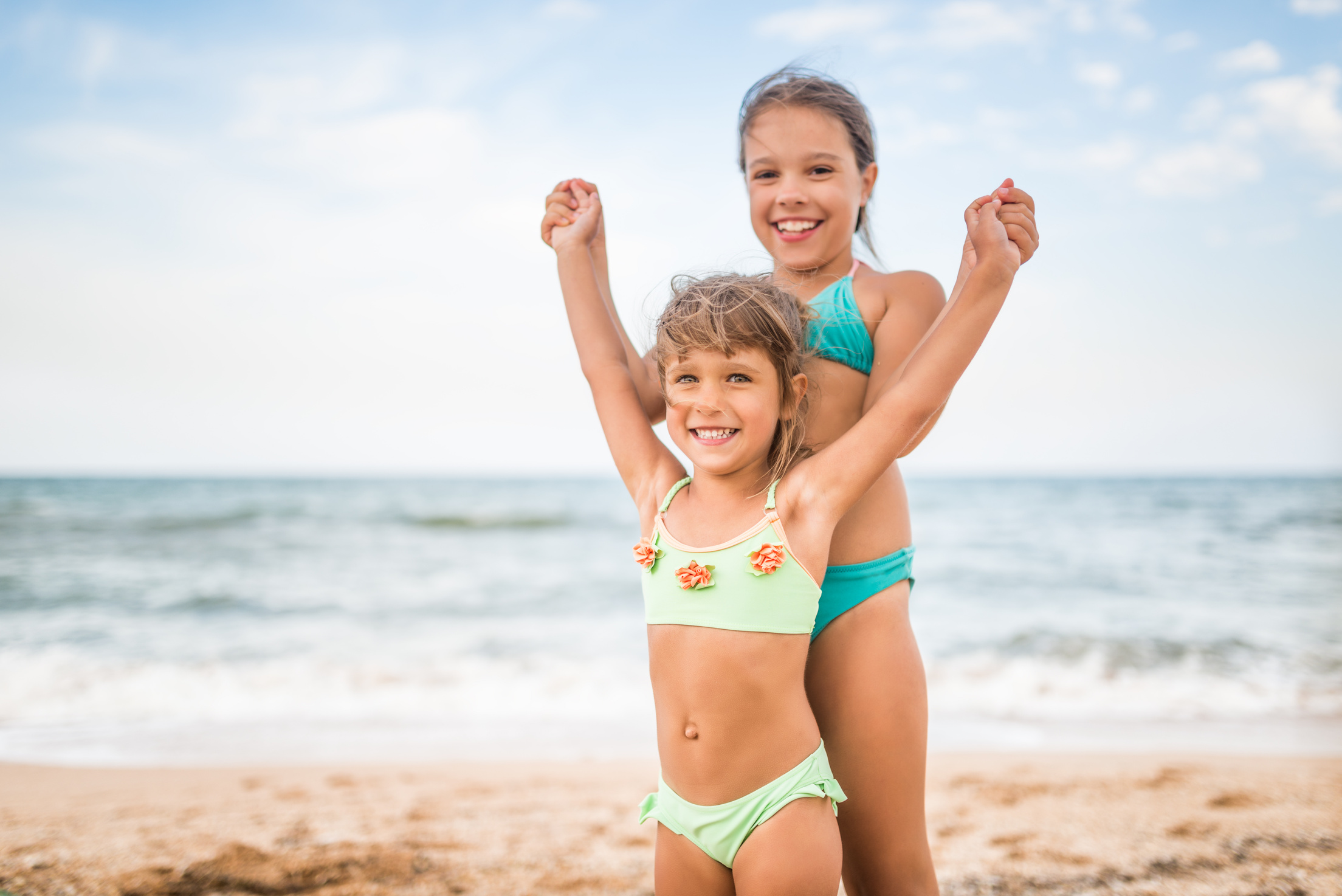 Two Cute Positive Little Girls Sisters